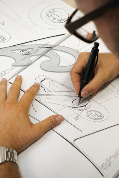 man working on a technical drawing
